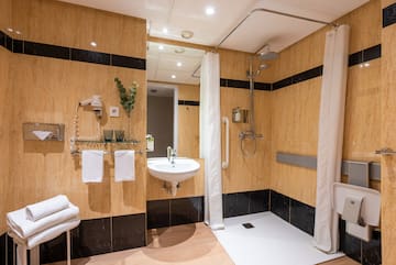a bathroom with a shower and sink