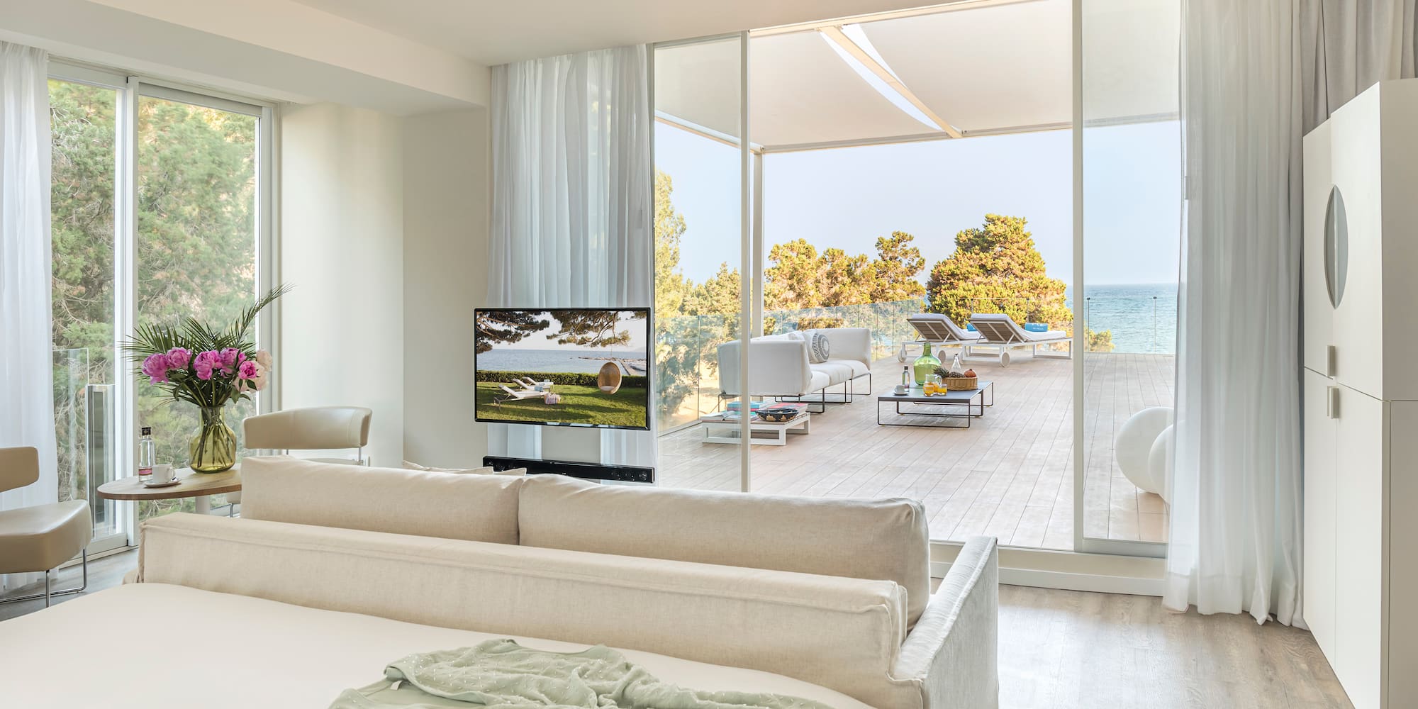 a room with a large bed and a television