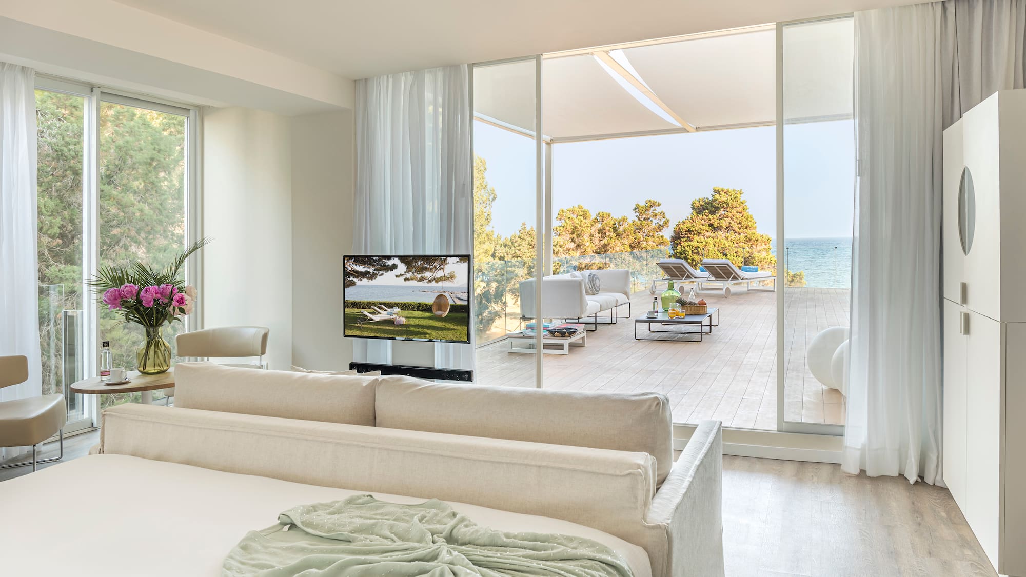 a room with a large bed and a television