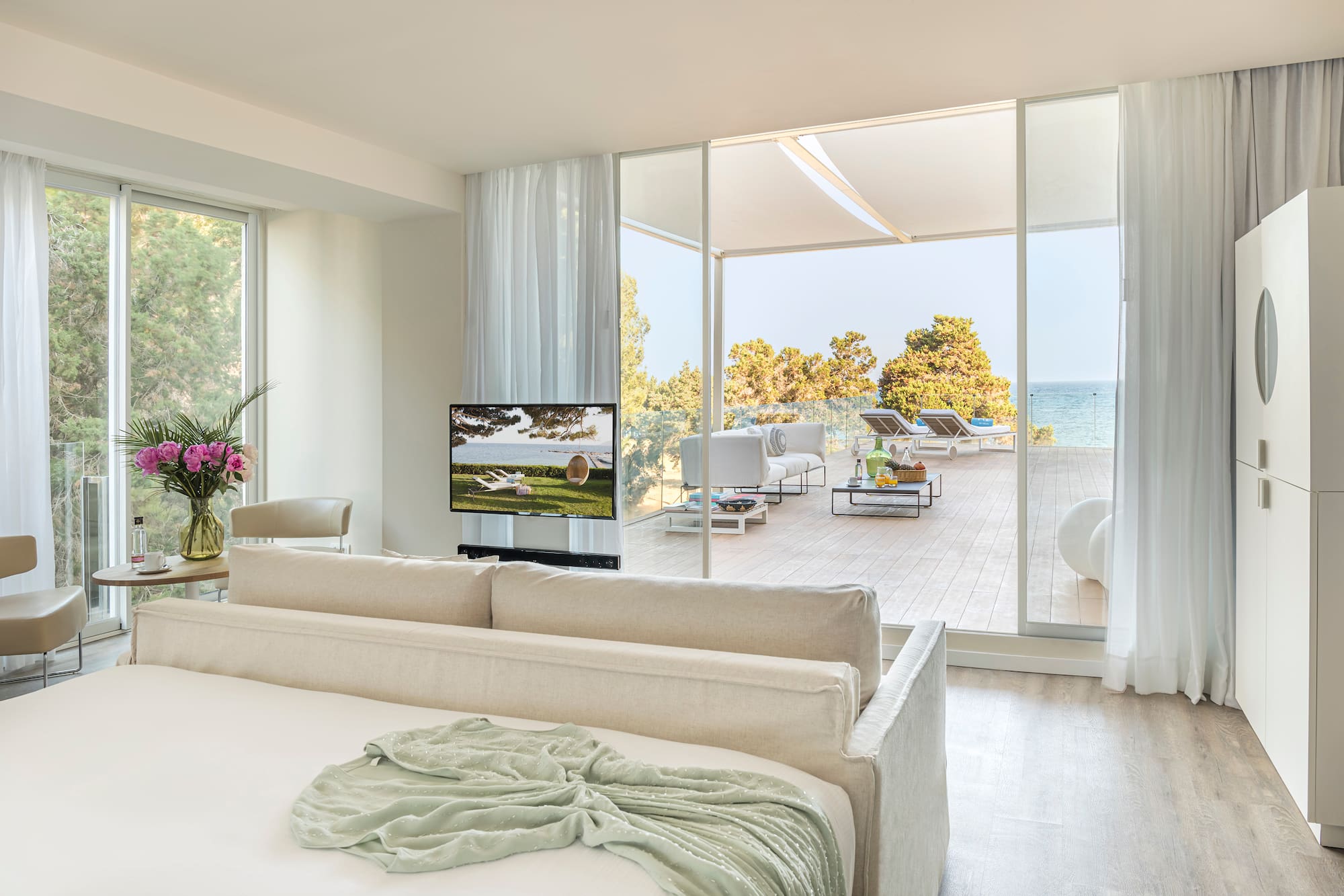 a room with a large bed and a television