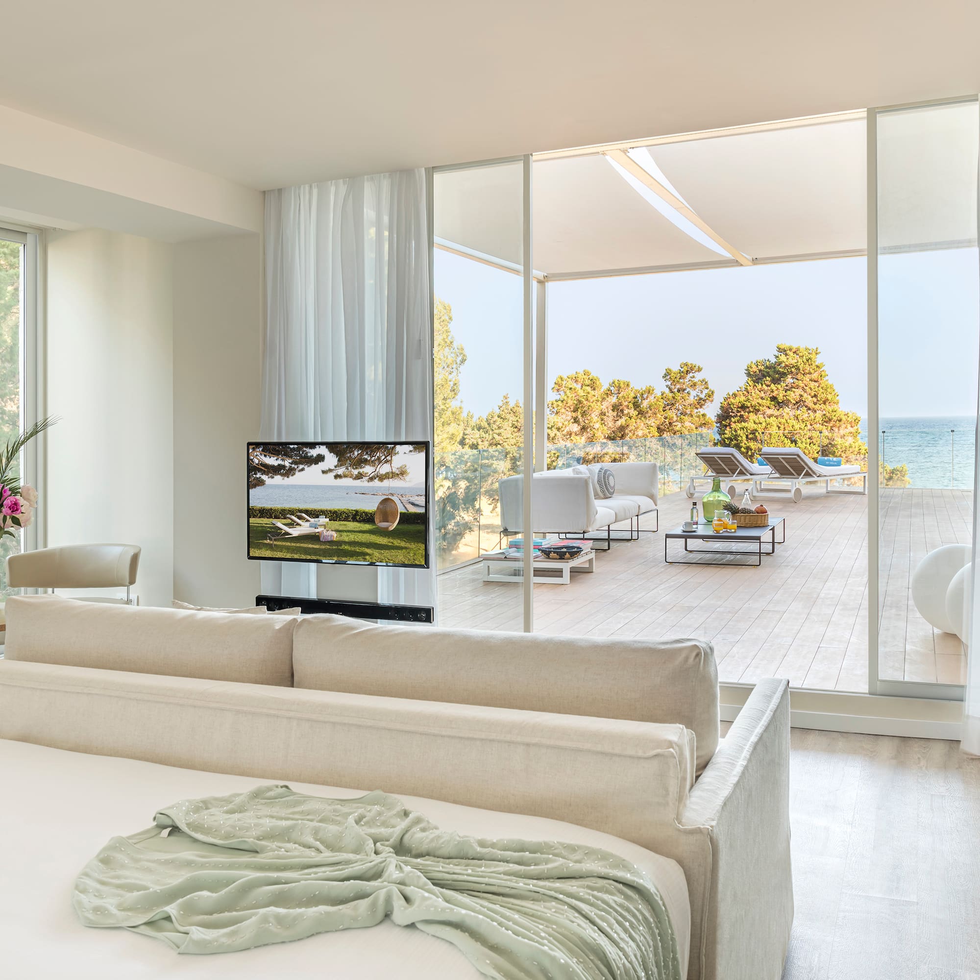 a room with a large bed and a television