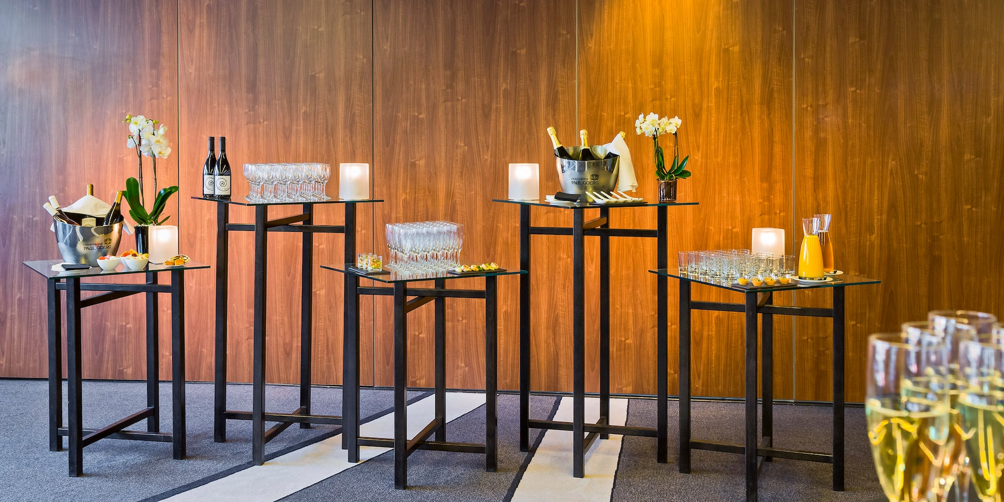a group of glasses and bottles on a table