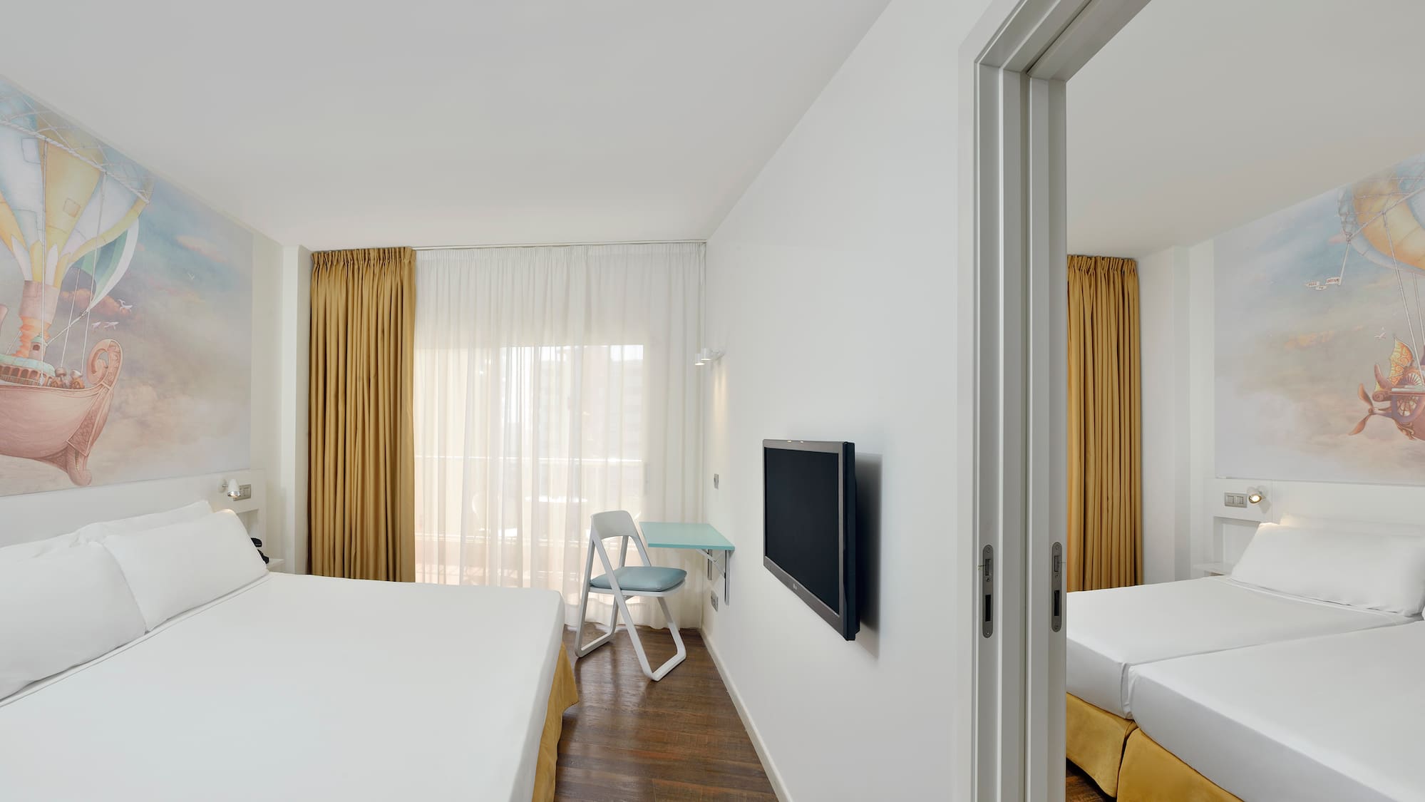 a room with a bed and a tv