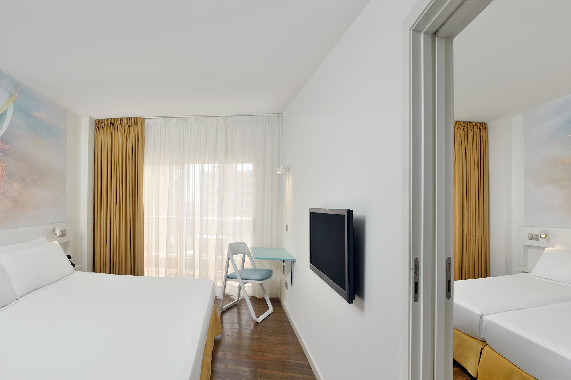 a room with a bed and a tv