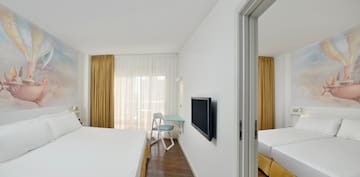 a room with a bed and a tv