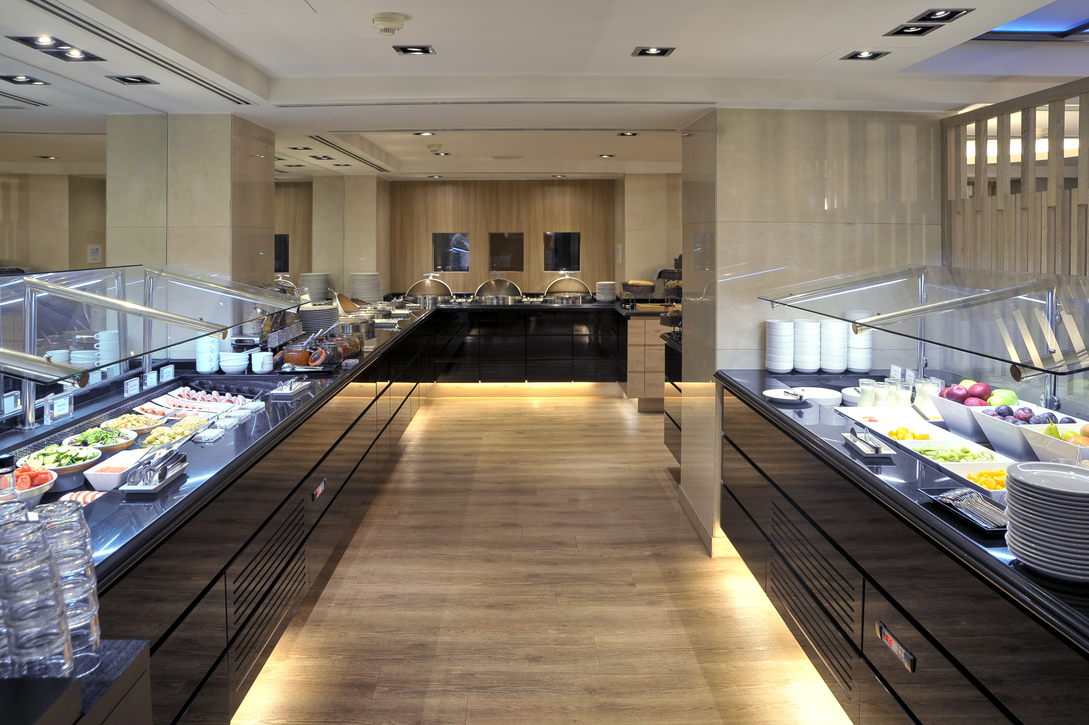 a buffet line with food on the counter