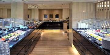 a buffet line with food on the counter