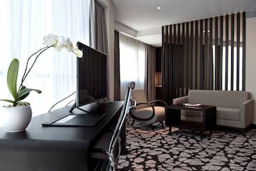a room with a television and a chair