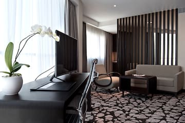 a room with a television and a chair