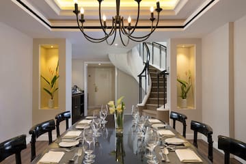 a dining table with glasses and plates