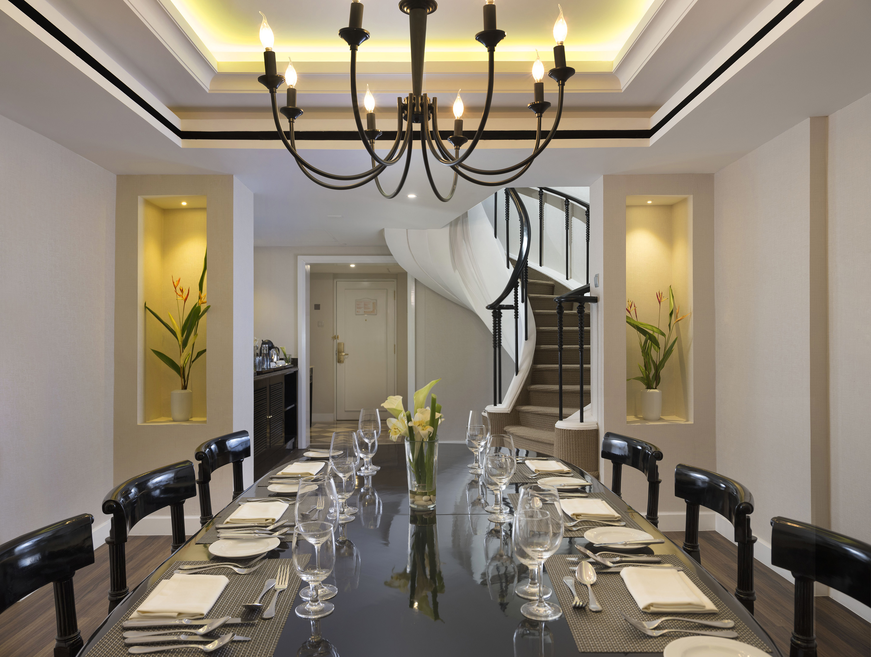 a dining table with glasses and plates