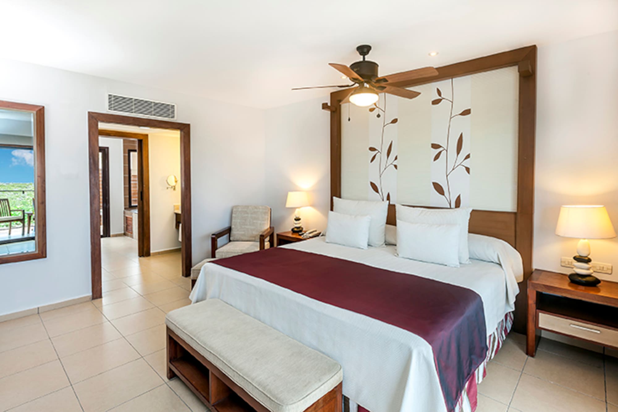 a bedroom with a bed and a fan