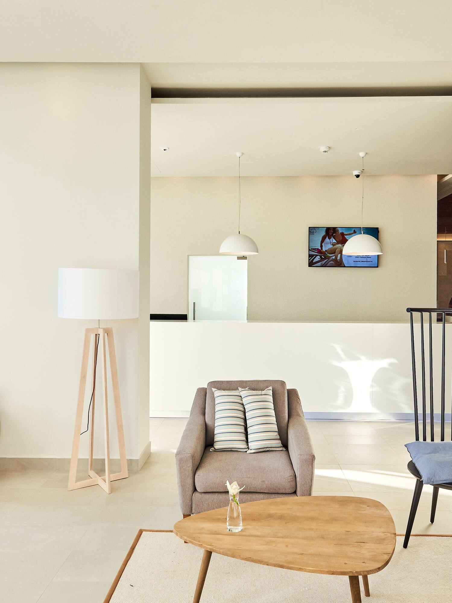 a living room with a couch and chairs