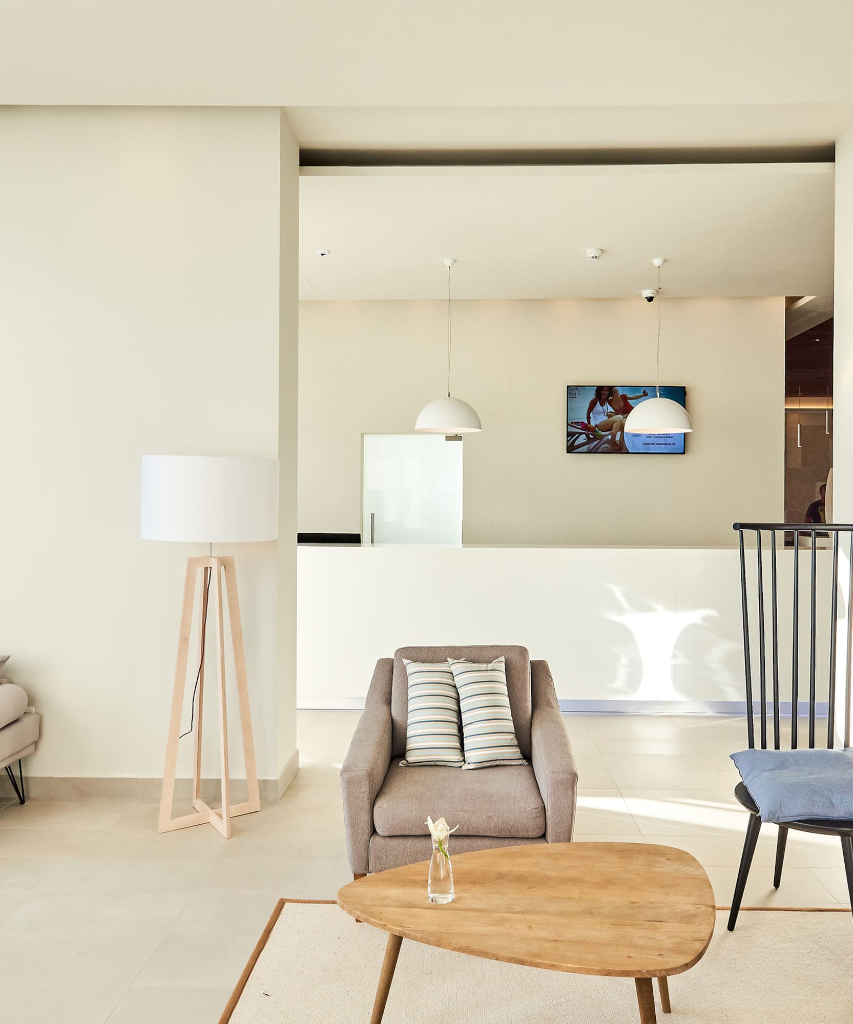 a living room with a couch and chairs