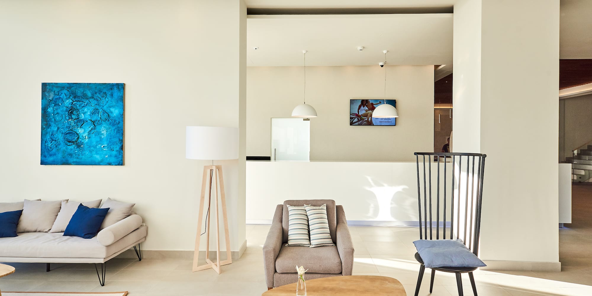 a living room with a couch and chairs