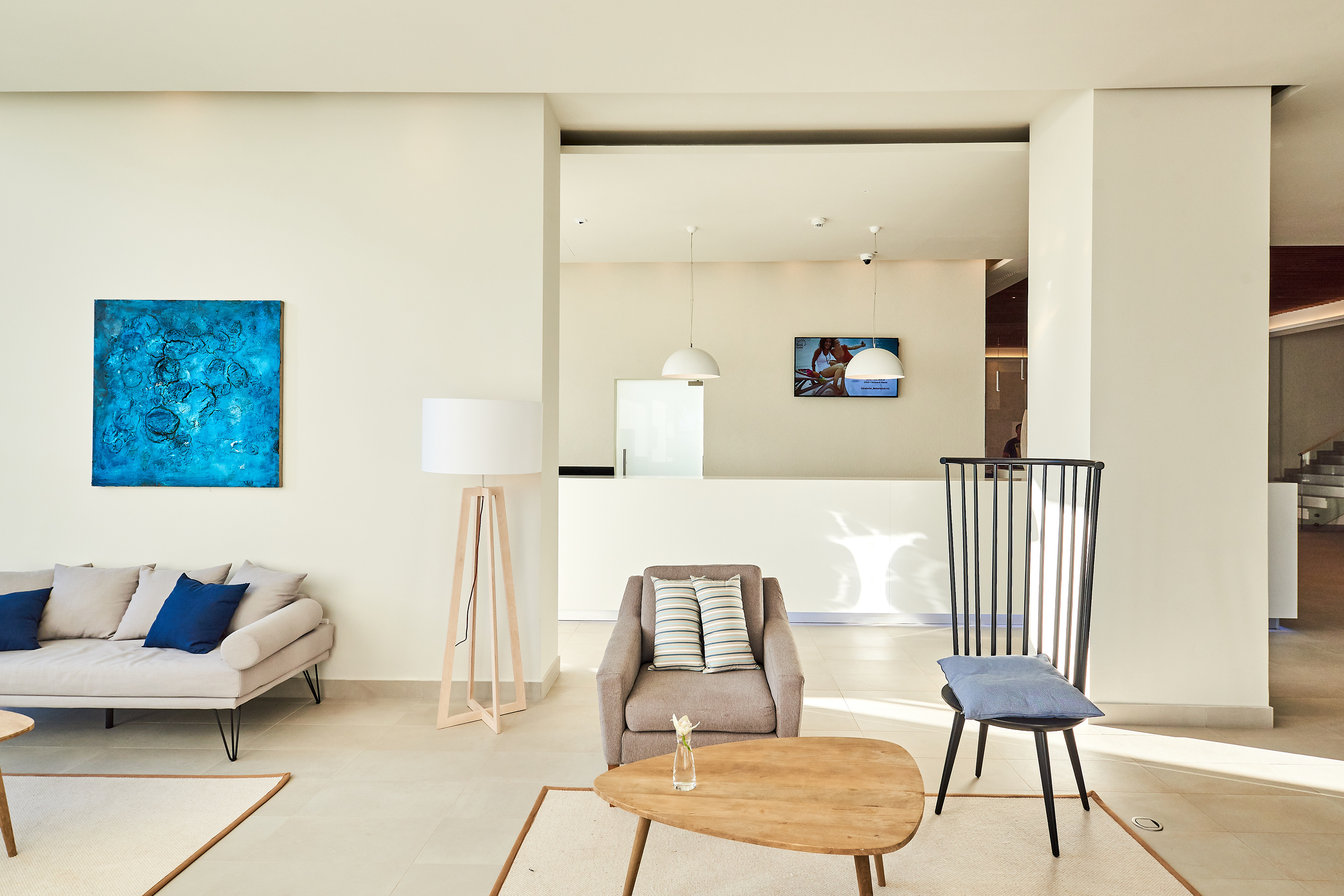 a living room with a couch and chairs