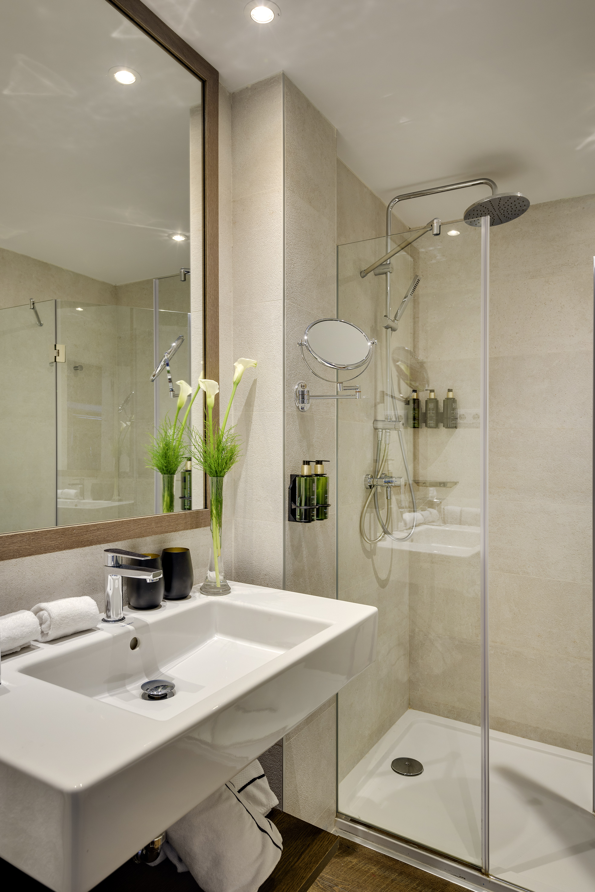 a bathroom with a shower and sink