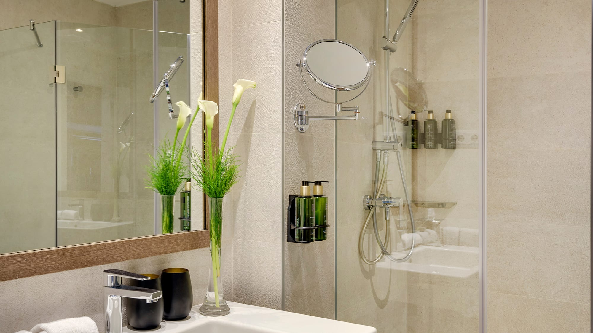 a bathroom with a shower and sink