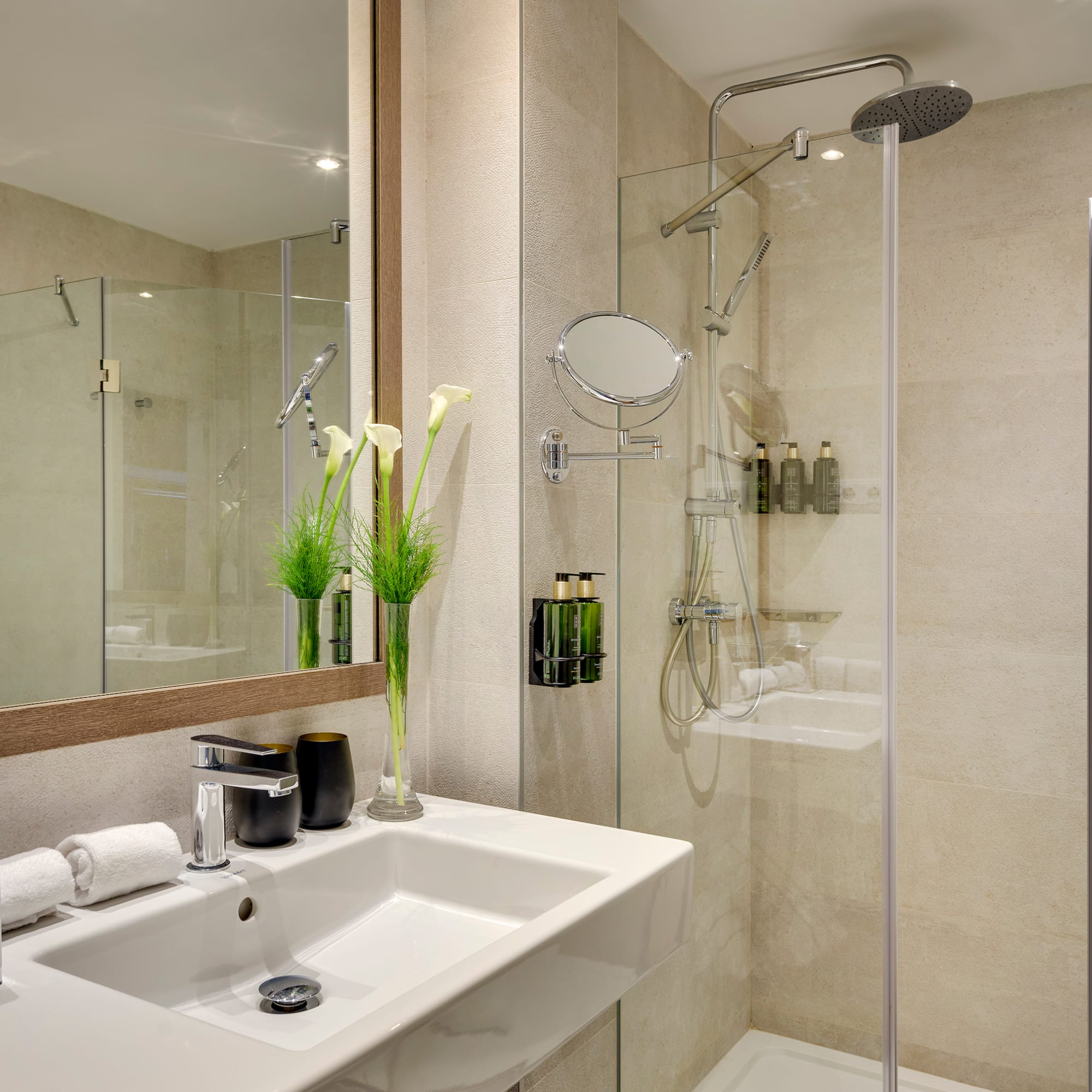 a bathroom with a shower and sink