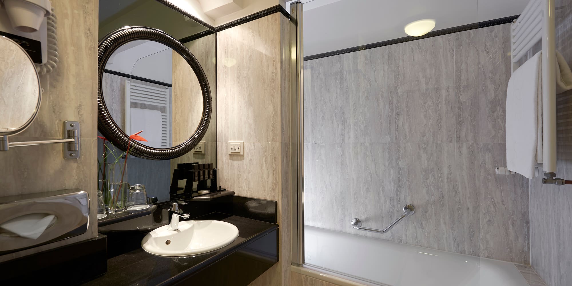 a bathroom with a tub and sink