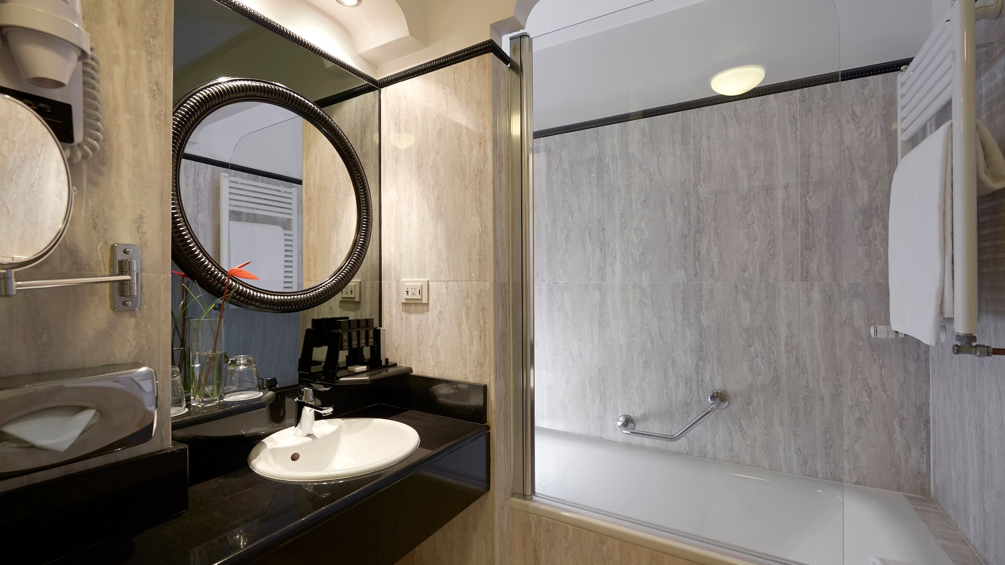 a bathroom with a tub and sink