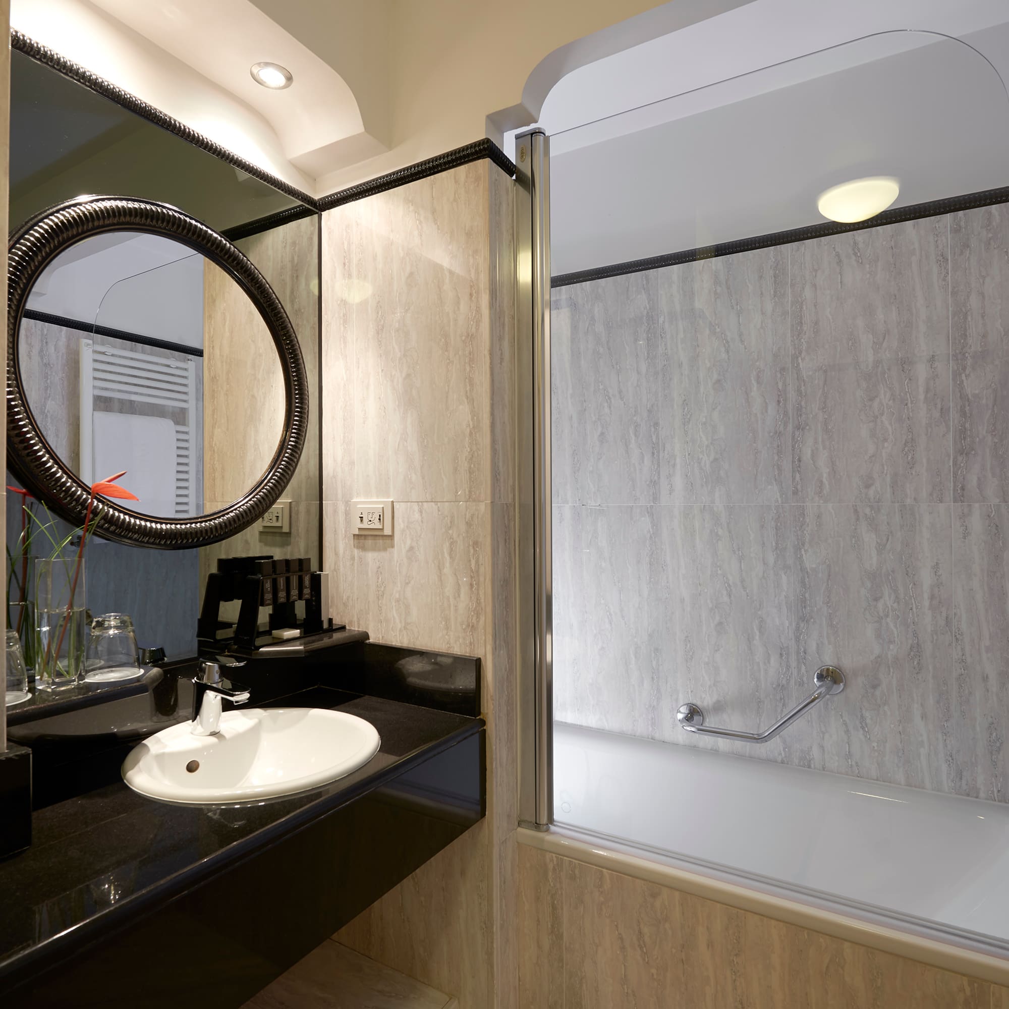 a bathroom with a tub and sink