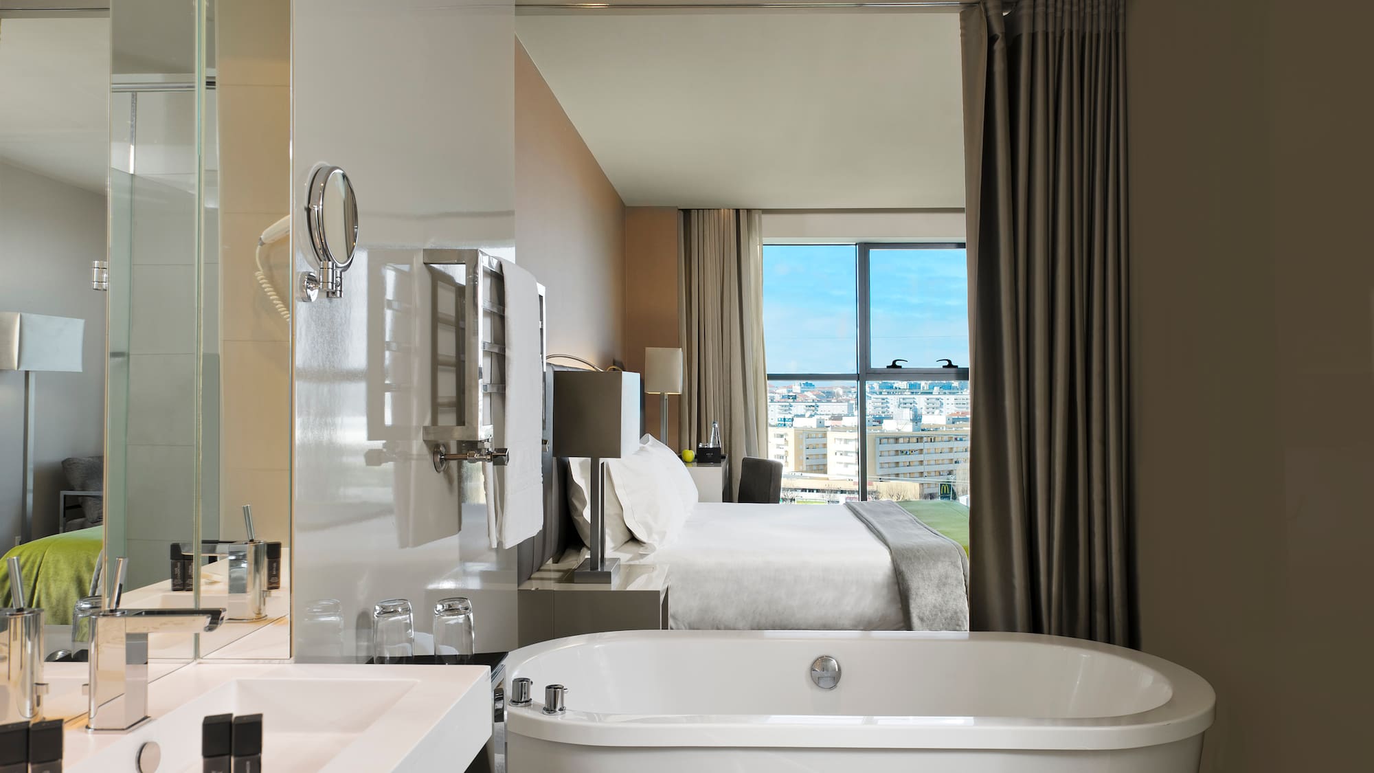 a bathroom with a bed and a bathtub