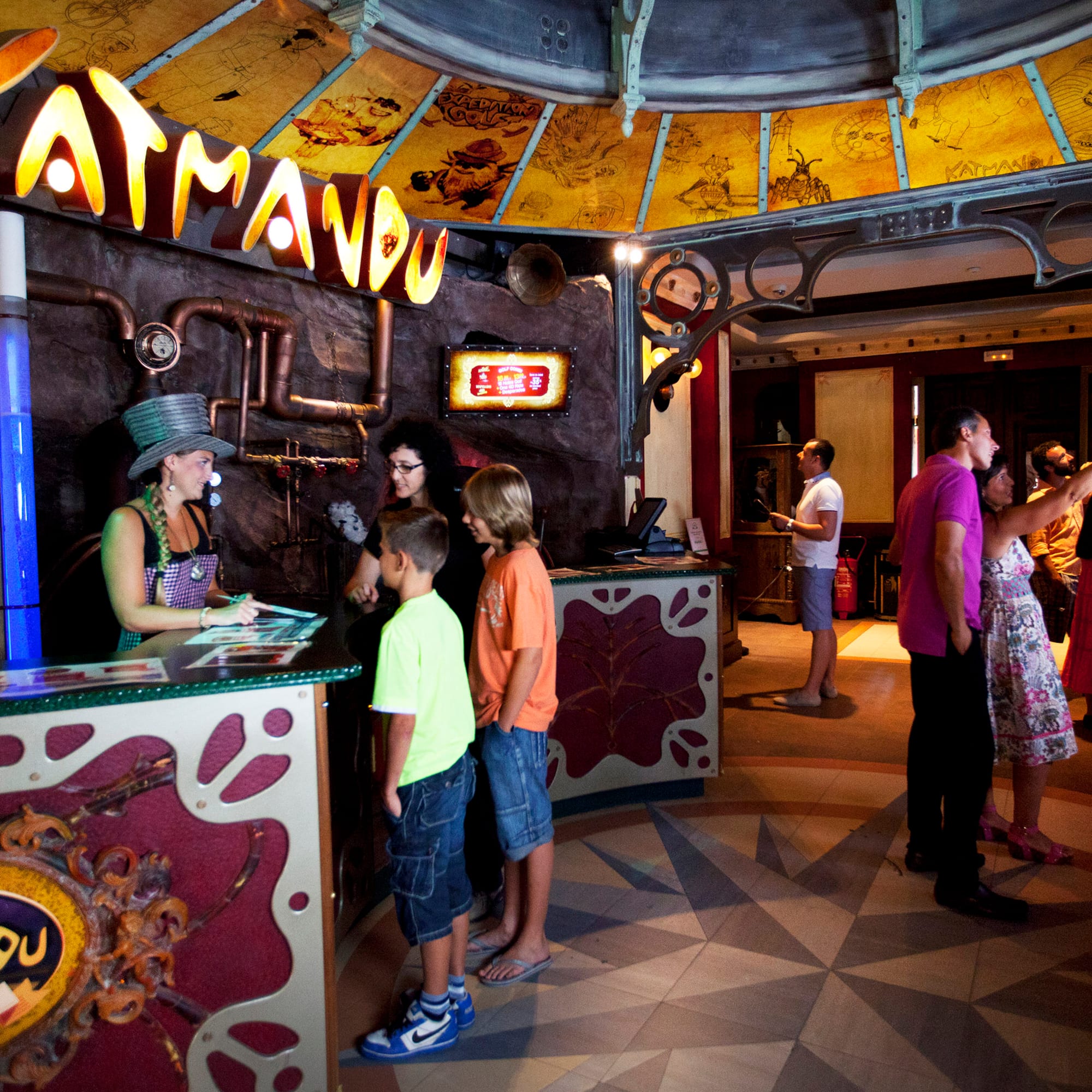 a group of people standing around a counter