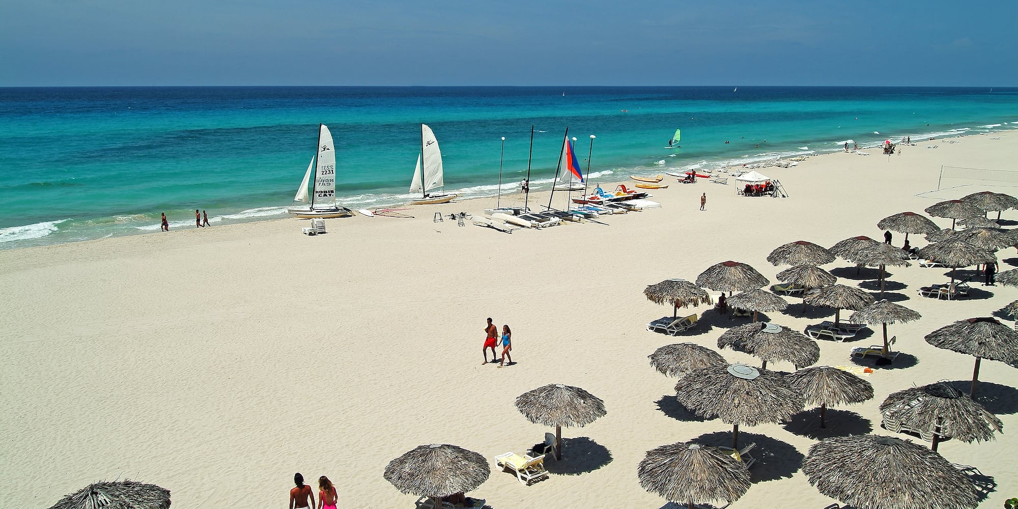 a group of people on a beach