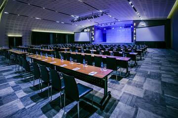 a large conference room with tables and chairs