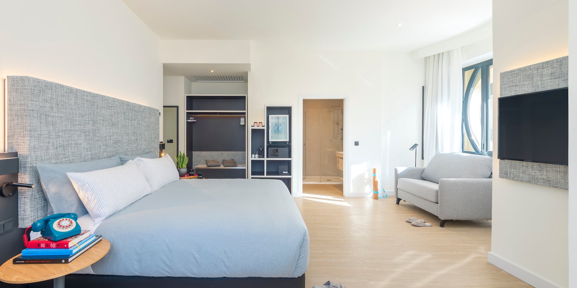 a bedroom with a bed and a couch