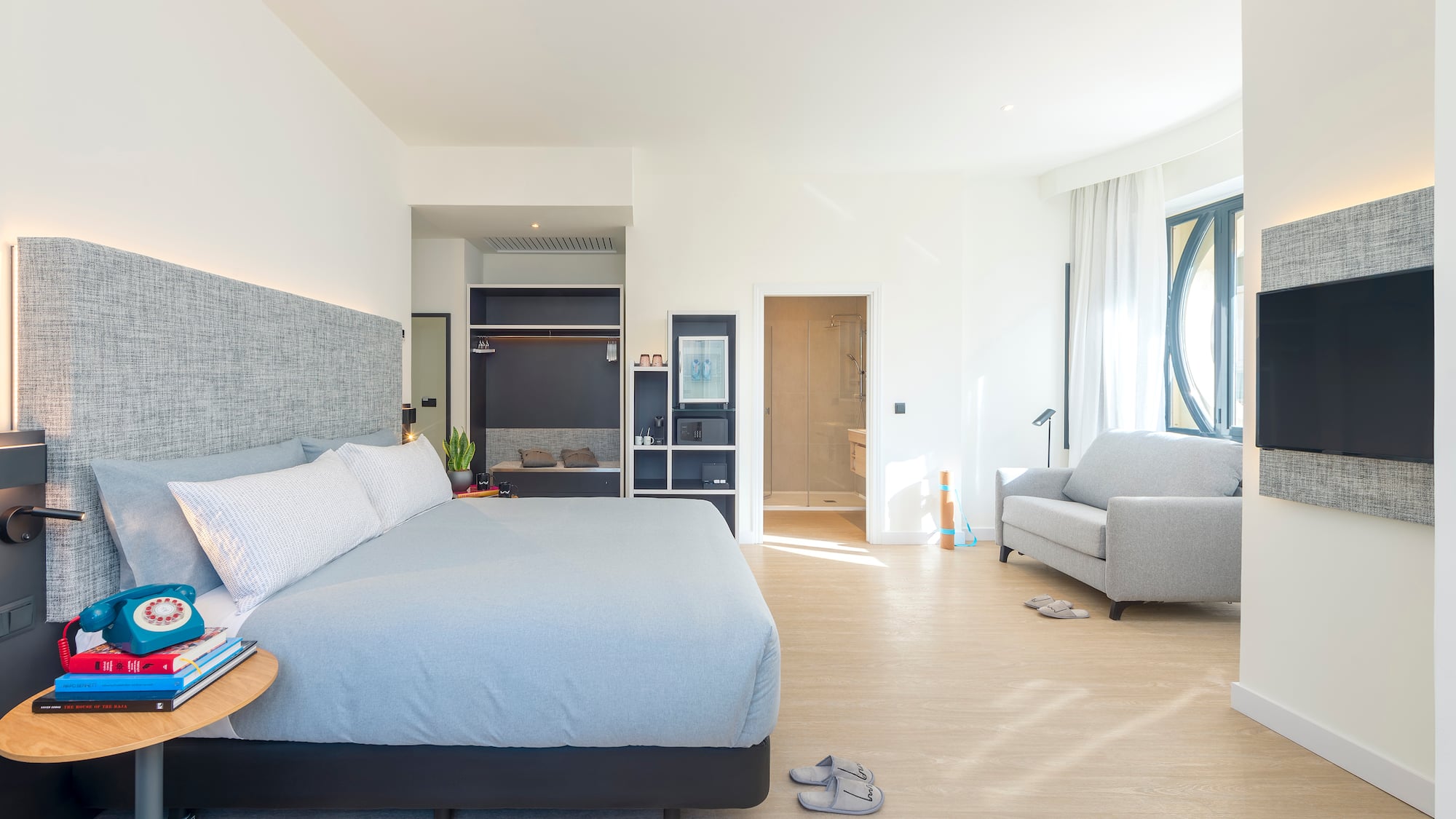 a bedroom with a bed and a couch