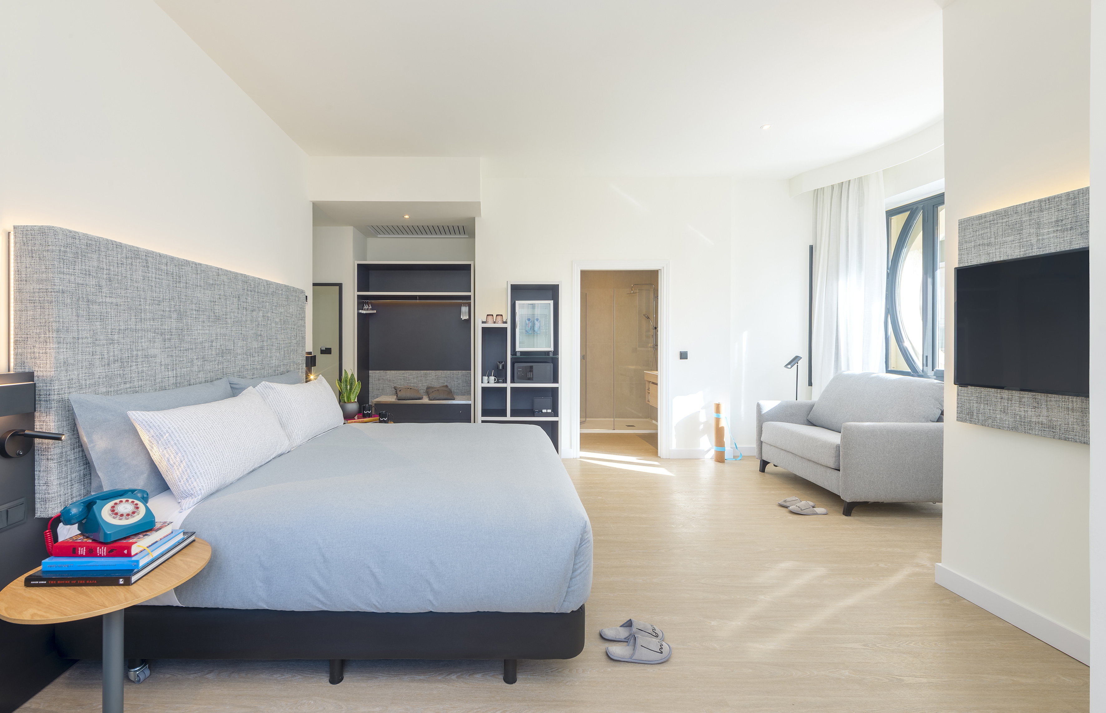 a bedroom with a bed and a couch