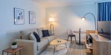 a living room with a couch and table