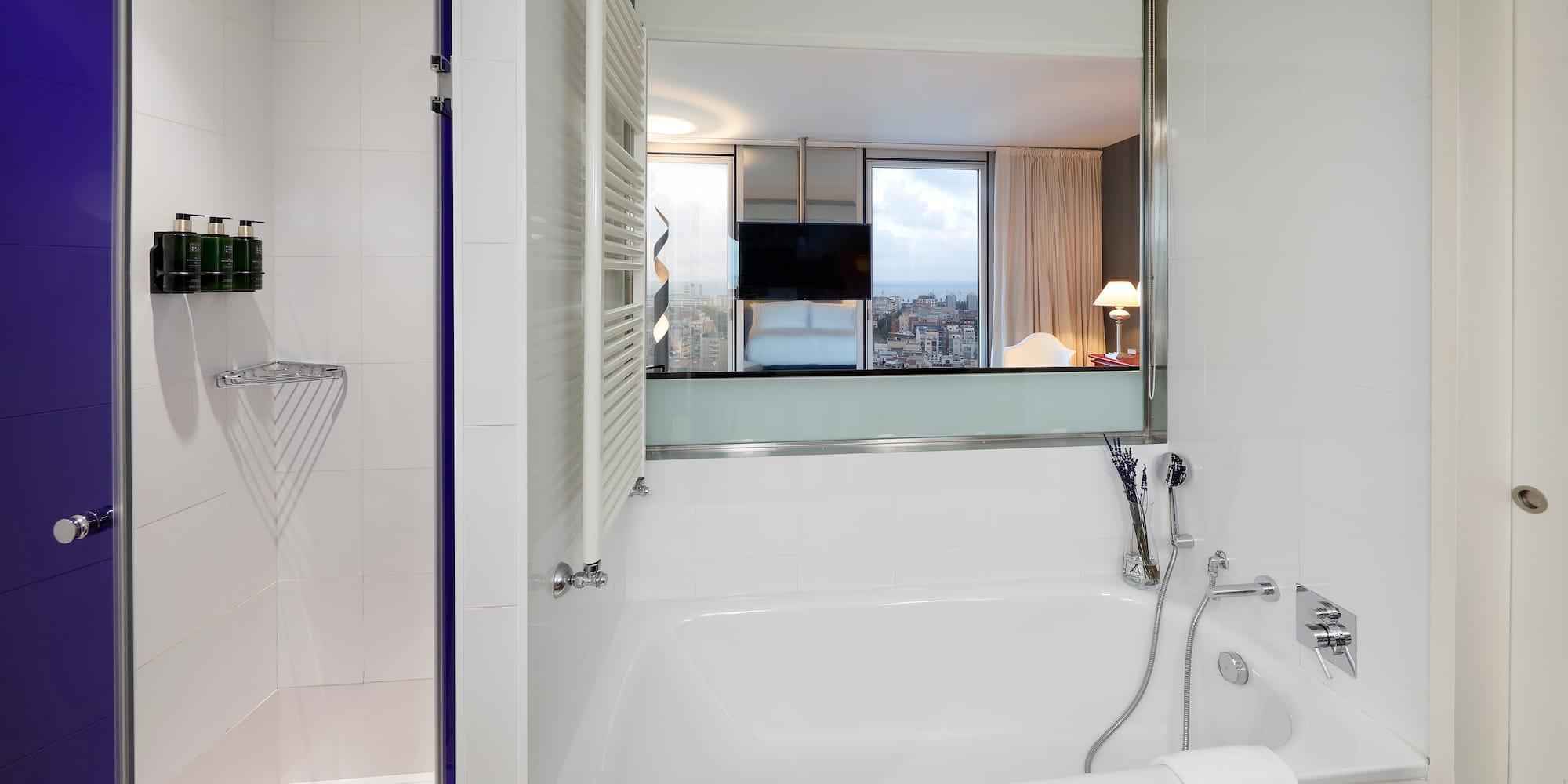 a bathroom with a bathtub and shower