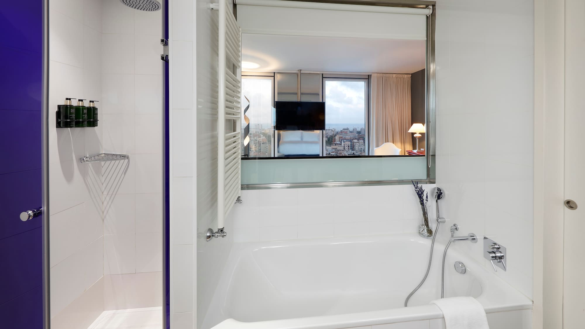 a bathroom with a bathtub and shower