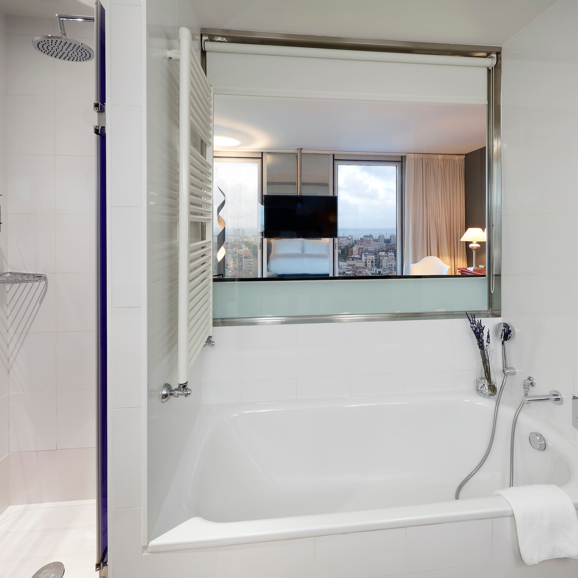 a bathroom with a bathtub and shower