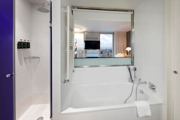 a bathroom with a bathtub and shower