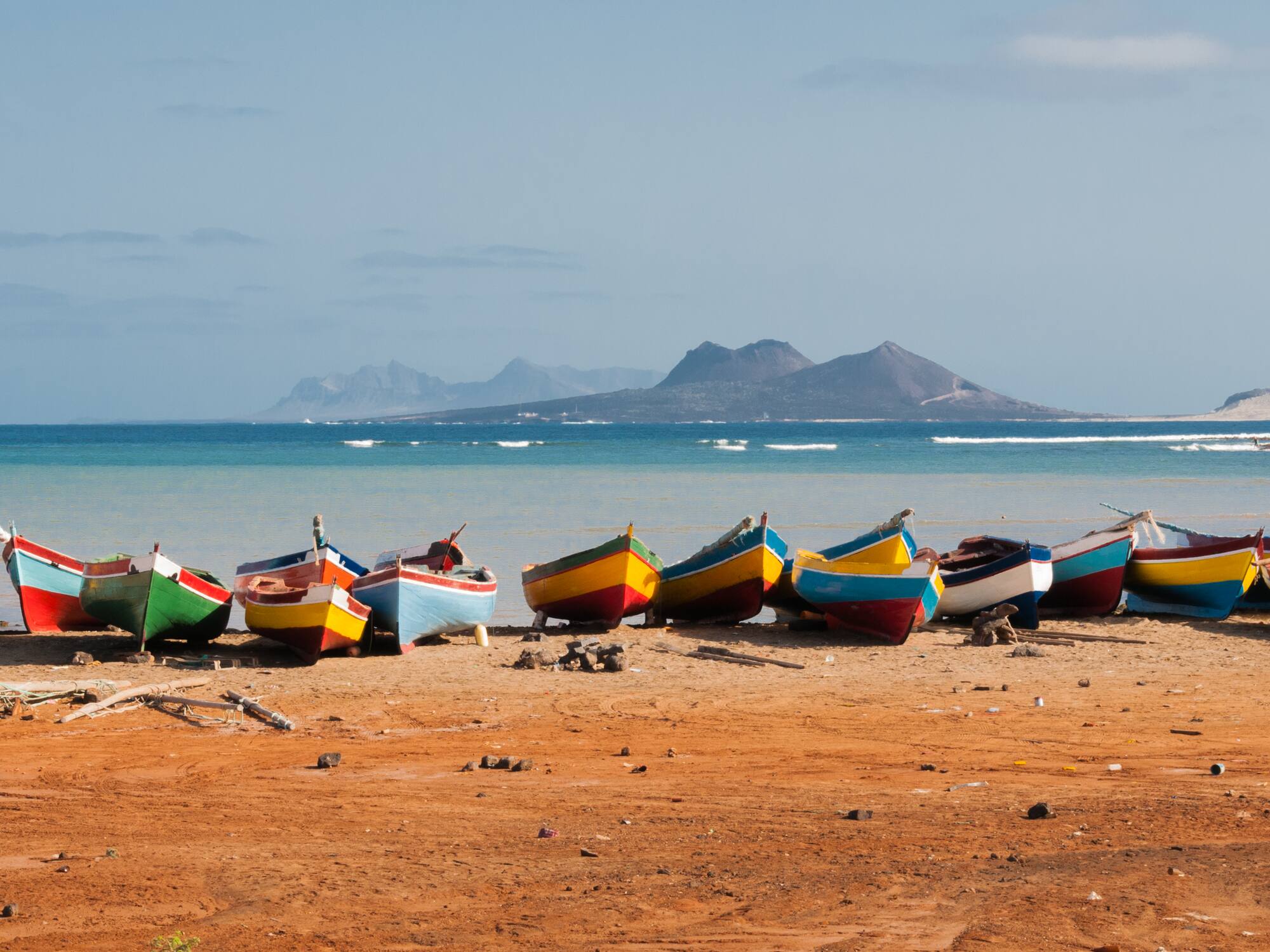 a group of boats on a beach