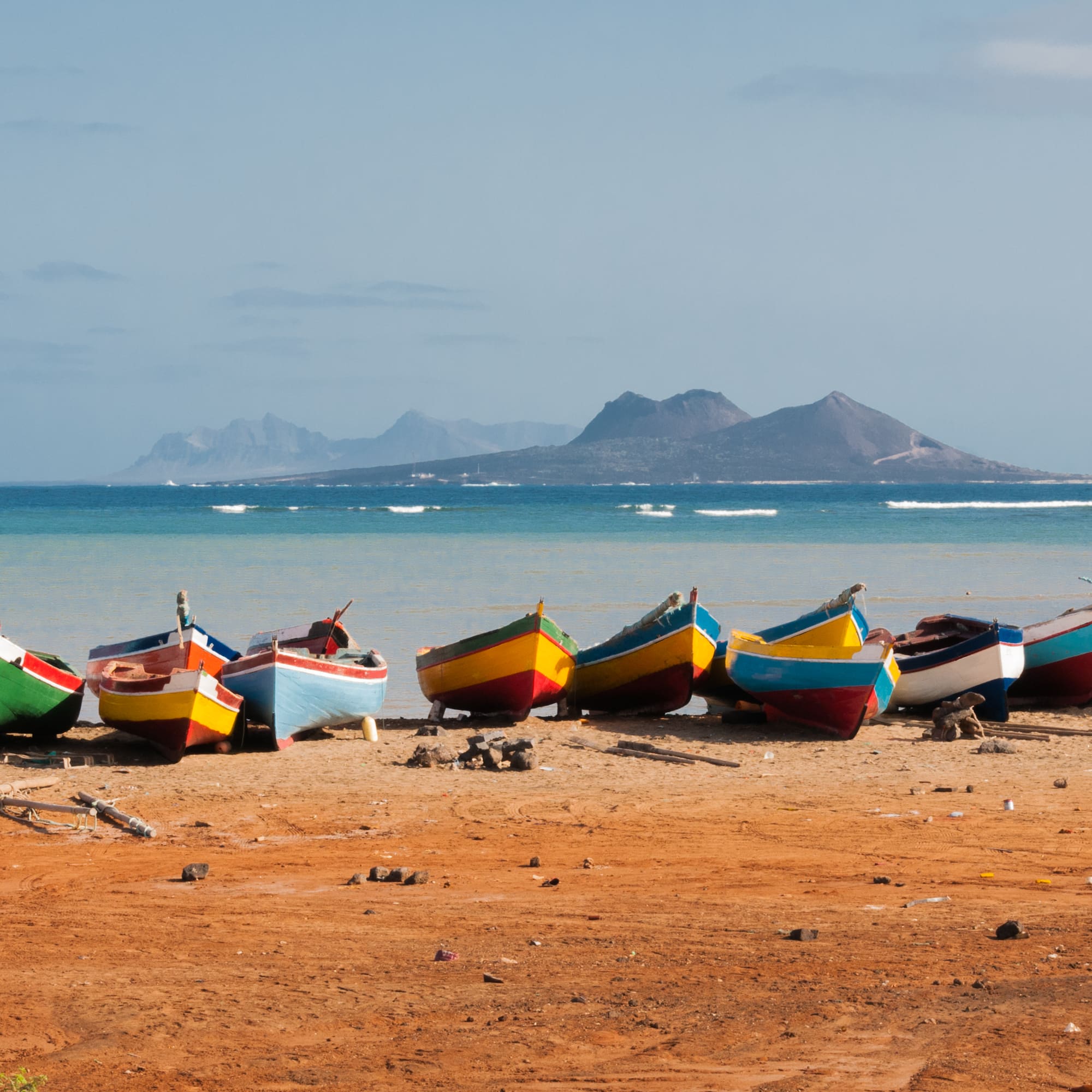 a group of boats on a beach