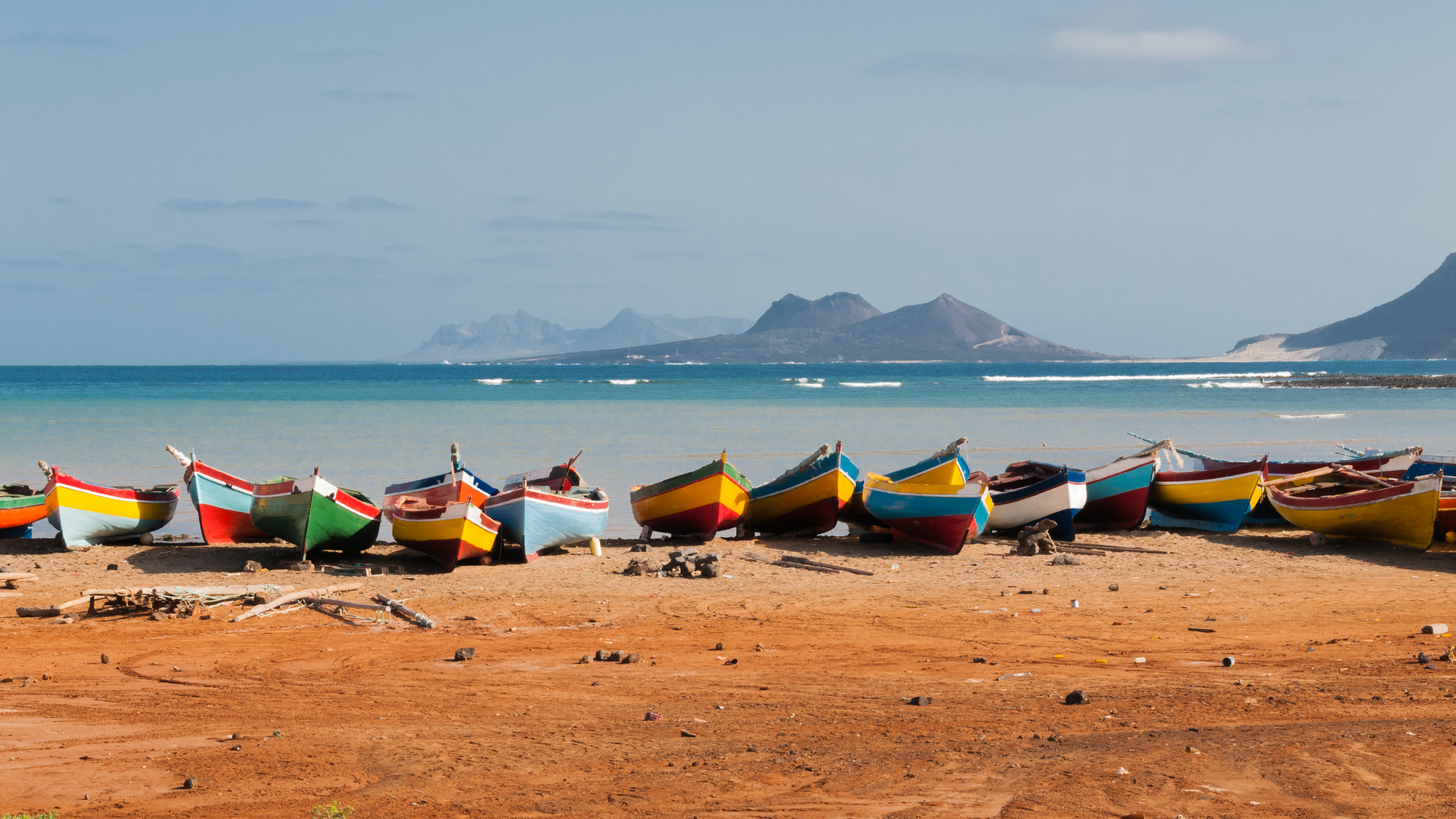 a group of boats on a beach