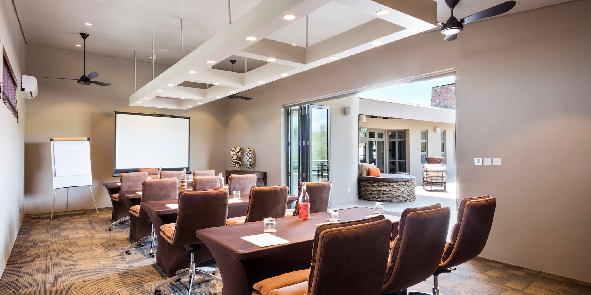 a room with a large table and chairs