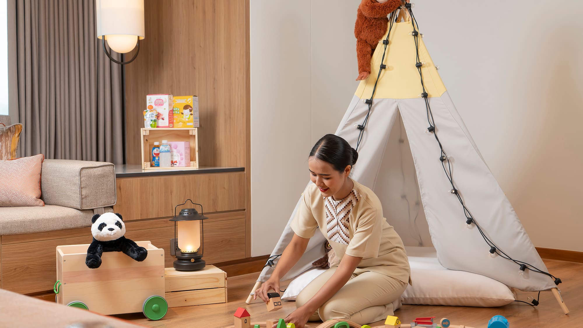 a woman playing with toys