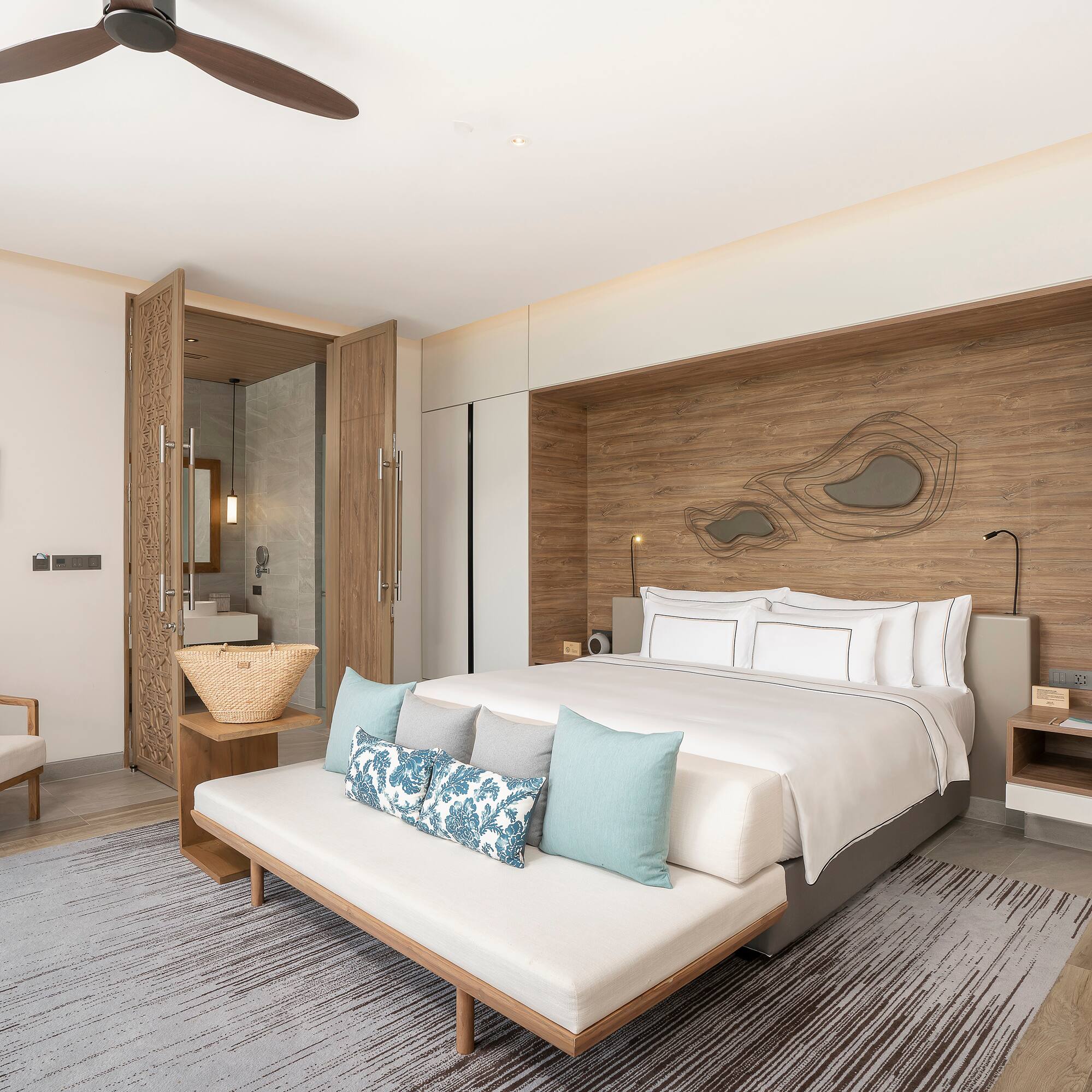 a room with a bed and a fan