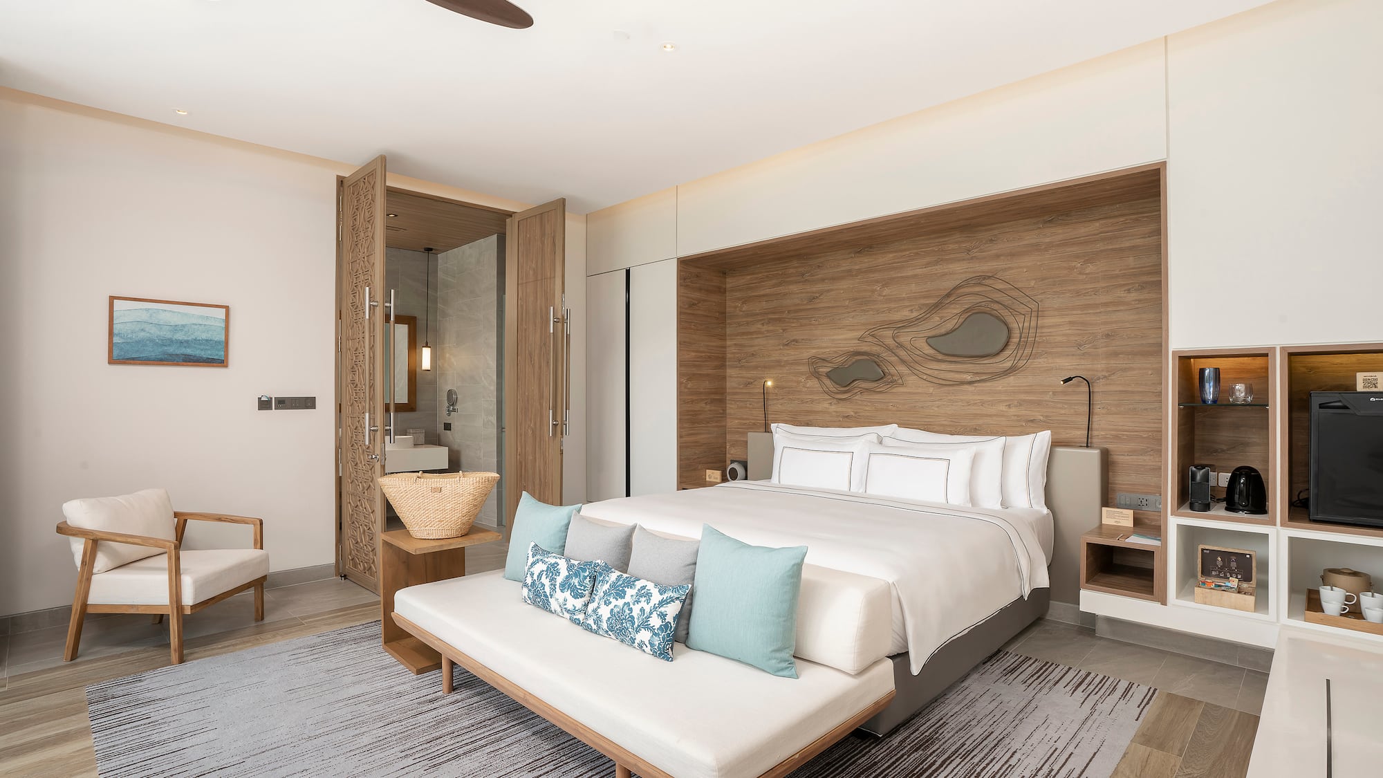 a room with a bed and a fan