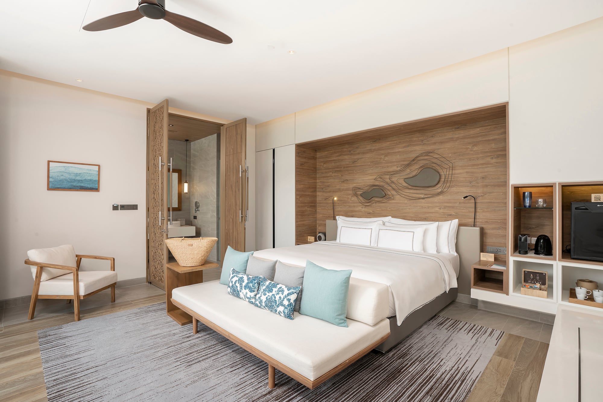 a room with a bed and a fan