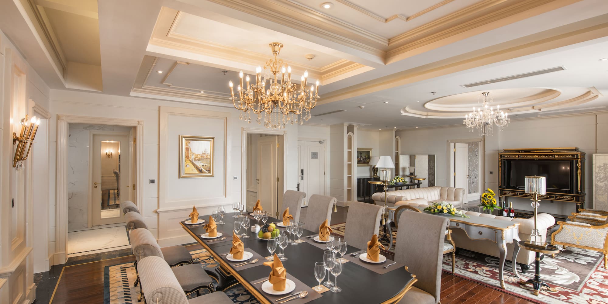 a large dining room with a chandelier and a table