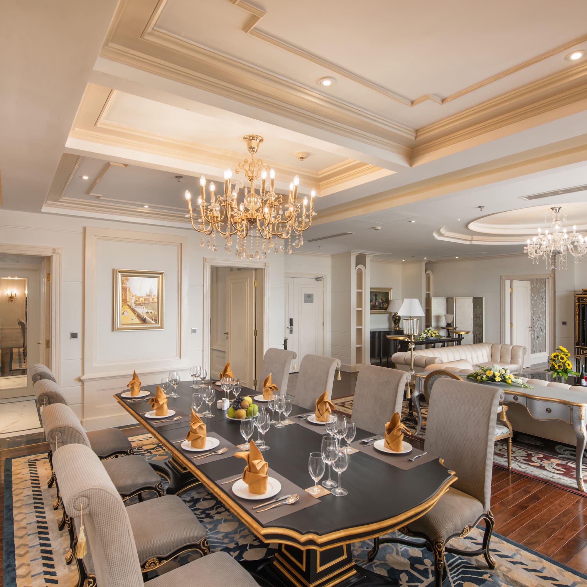 a large dining room with a chandelier and a table