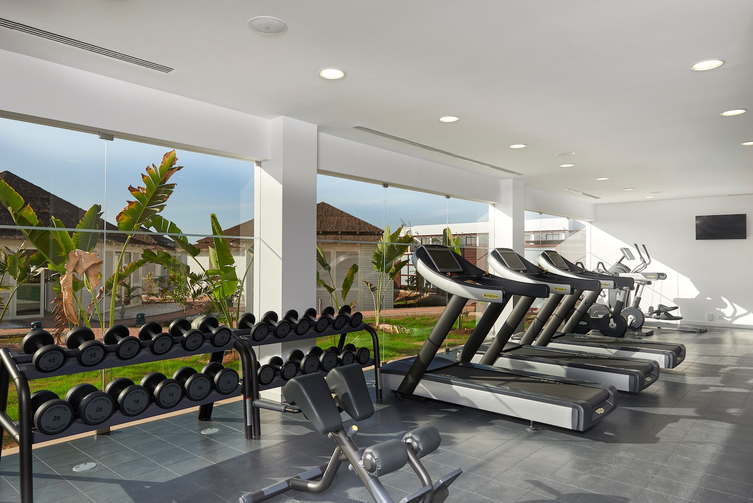 a room with treadmills and exercise equipment