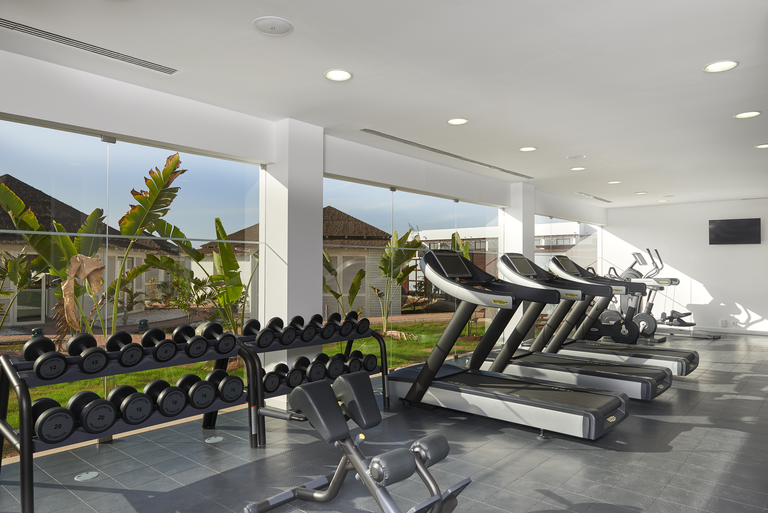 a room with treadmills and exercise equipment